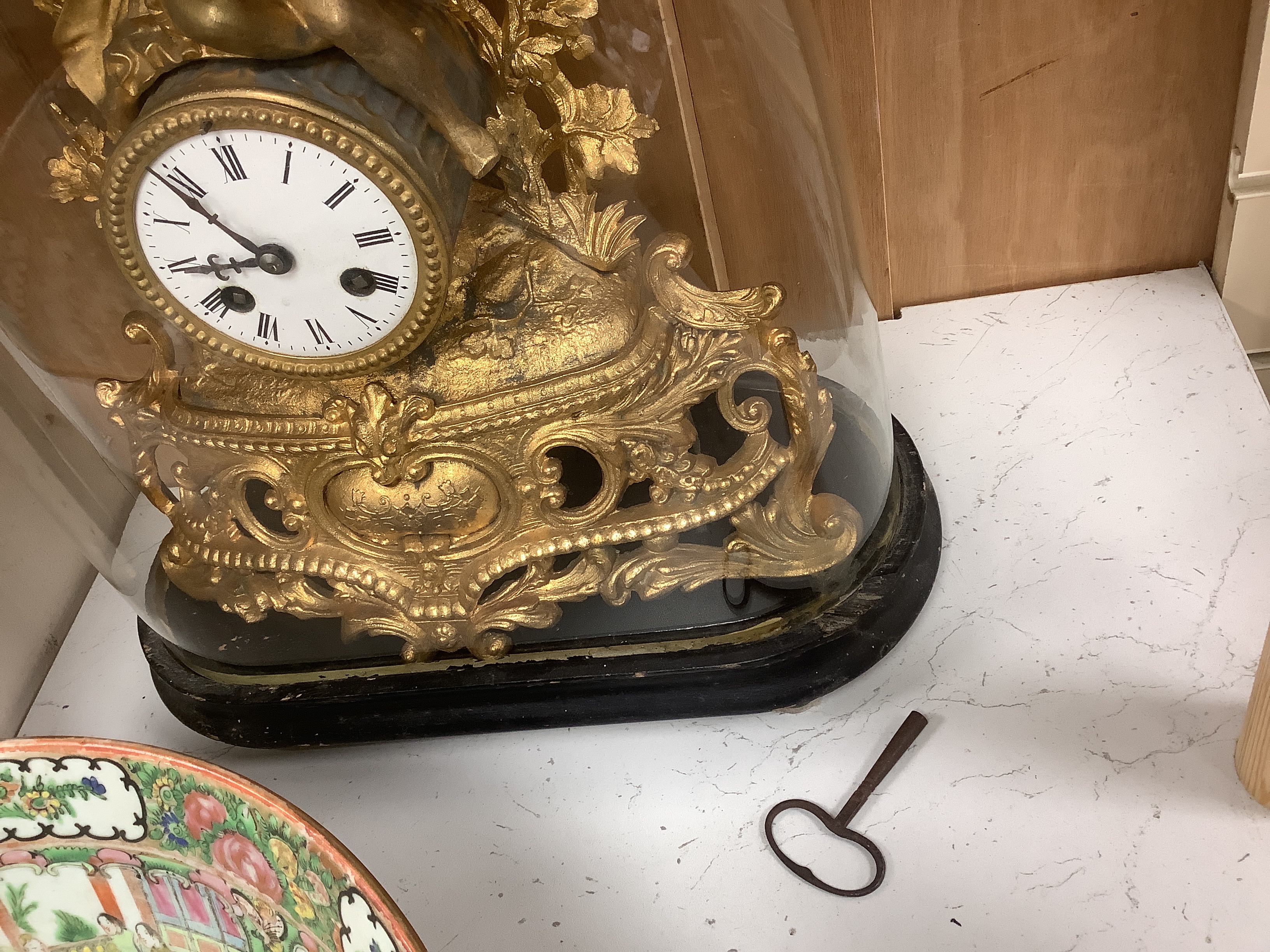 A 19th century Louis XVI-style gilt metal mantel clock, under glass dome, French movement striking on a bell, with key, 41cm